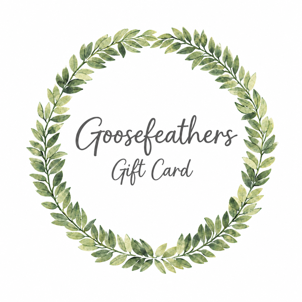 Goosefeathers gift card with a green leaf wreath on a white background